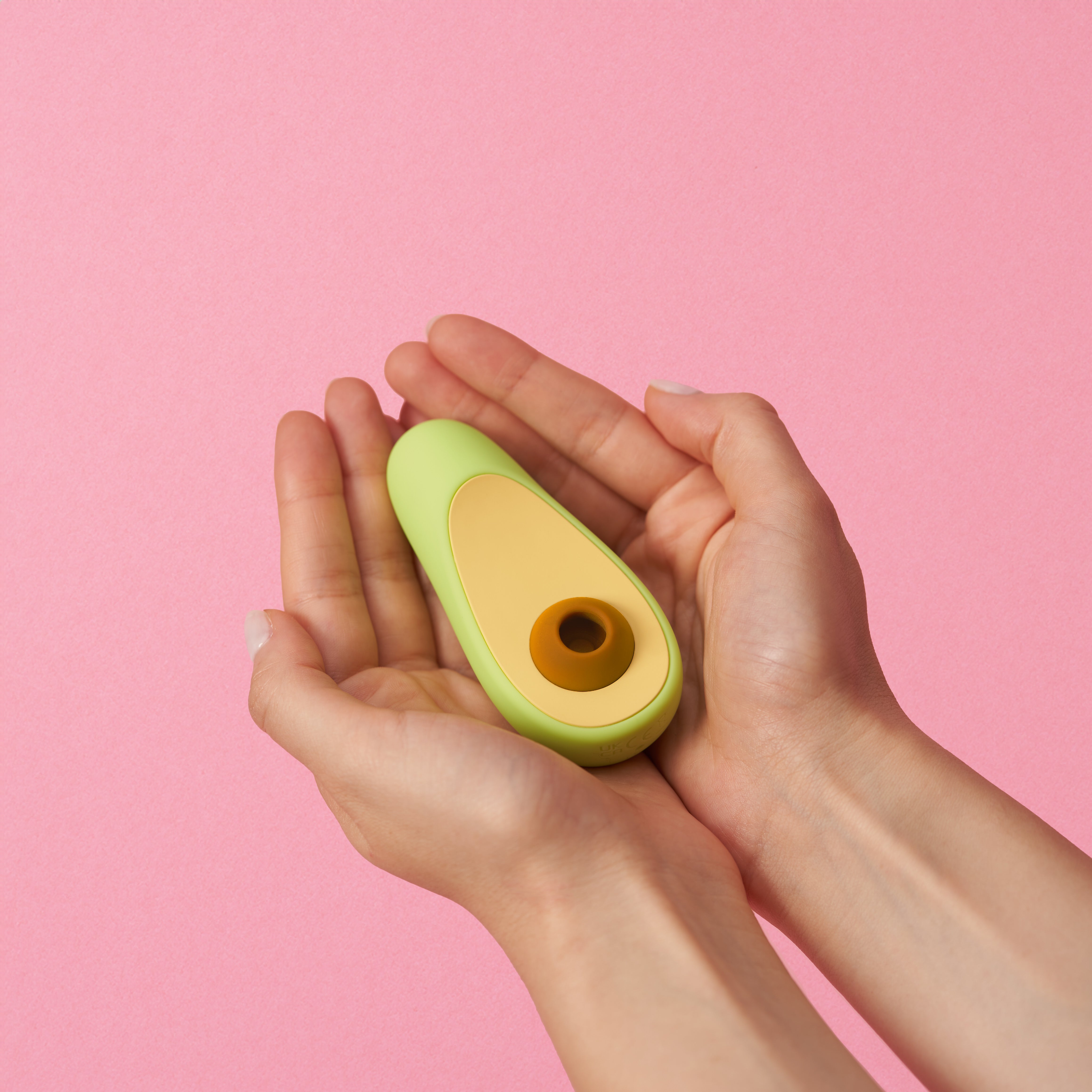 Avocado clitoral vibrator in hand