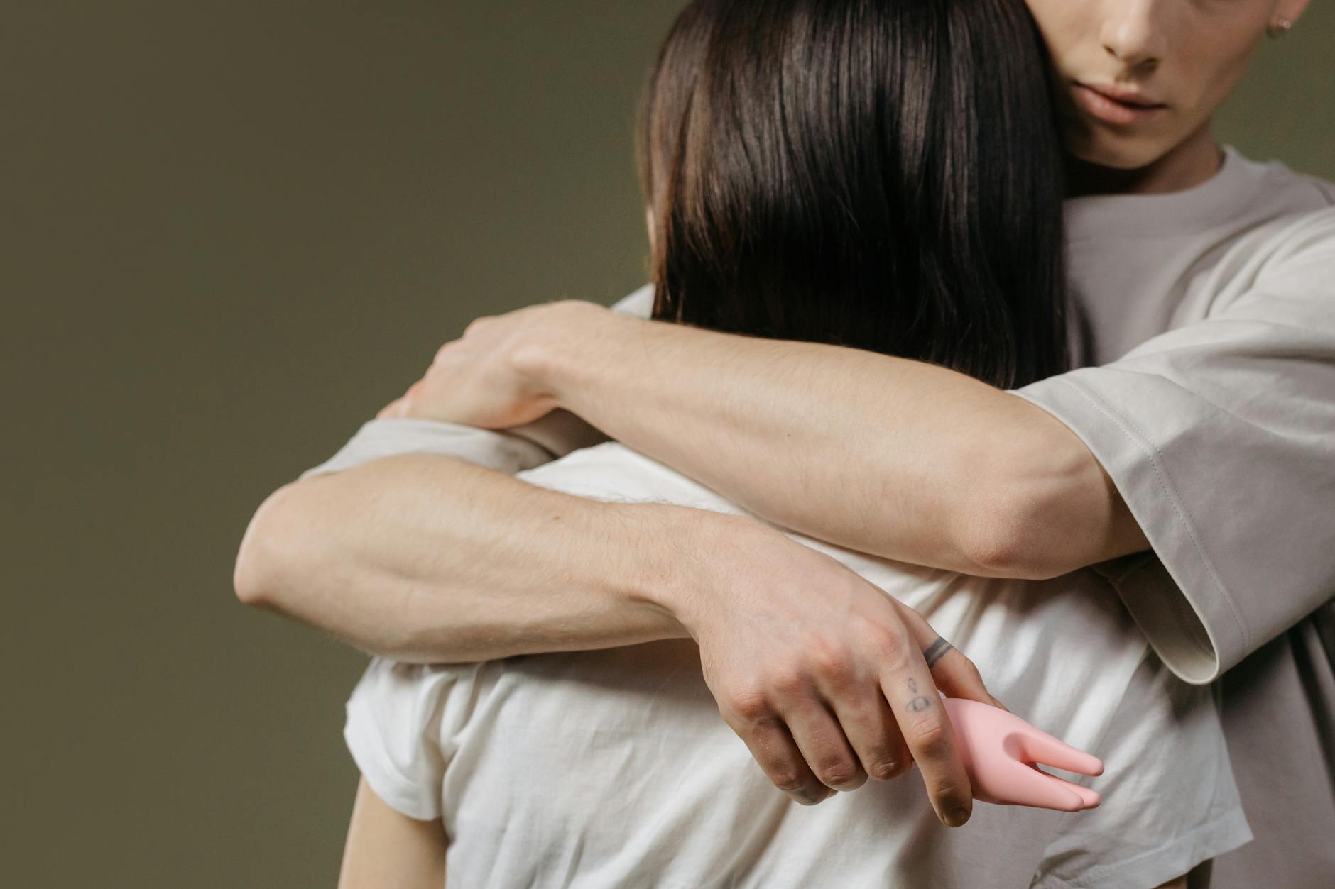 Close-up of a person embracing themselves in a moment of self-care and solitude.